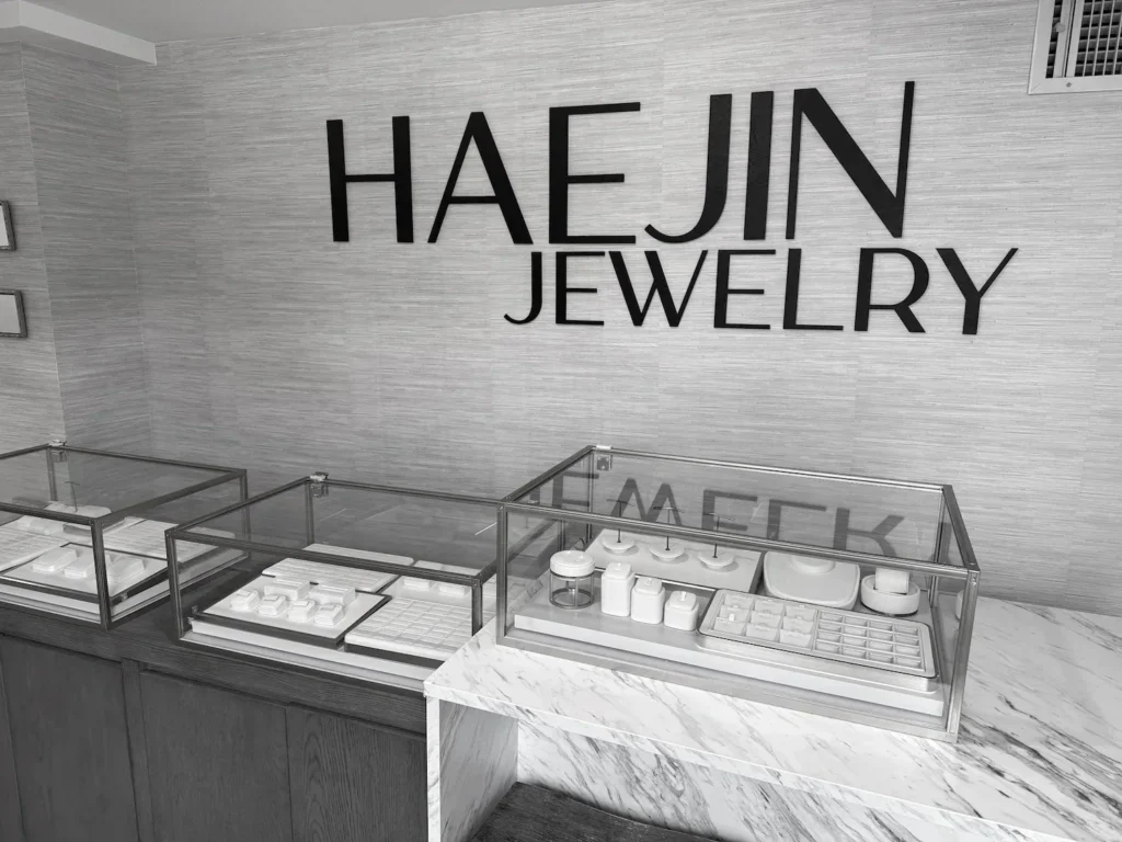 Haejin Jewelry studio interior in Williamsburg Brooklyn with diamond display cases and signage
